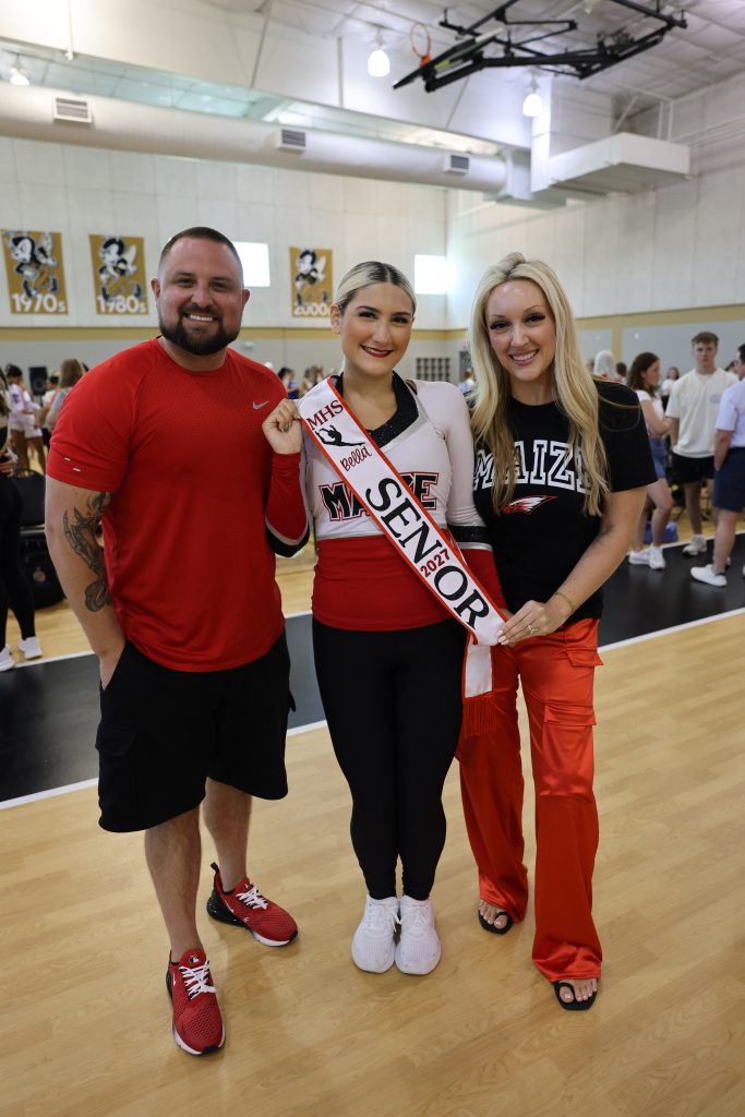 Eastep family with a FlyGirls dancer wearing her senior sash
