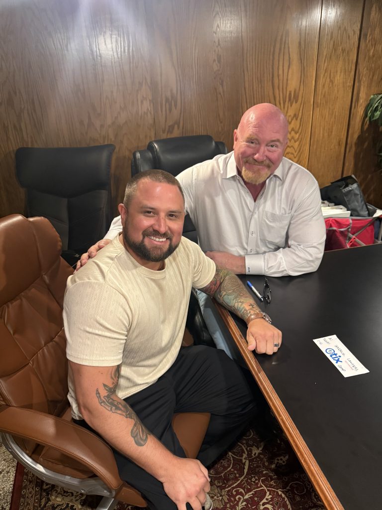 Kurt Kerns and Ryan Eastep seated together in an office