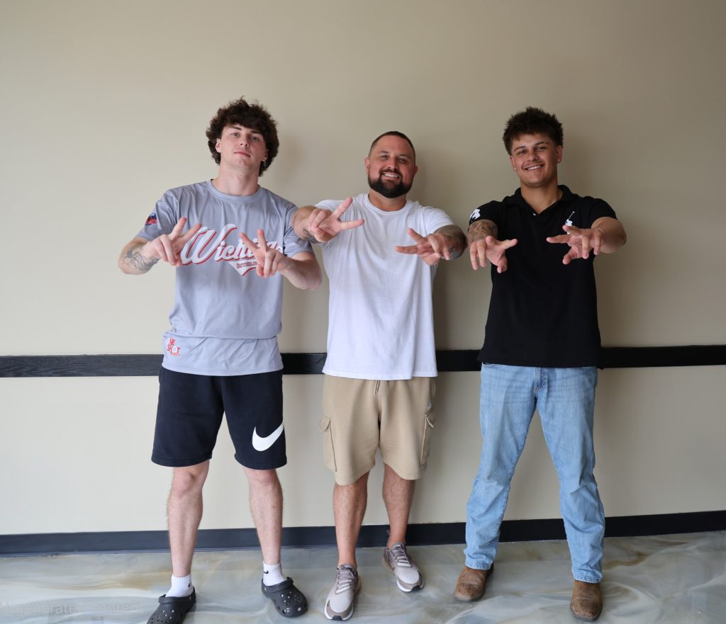 Ryan Eastep, Kurtis Smith and Gage Eastep posing together